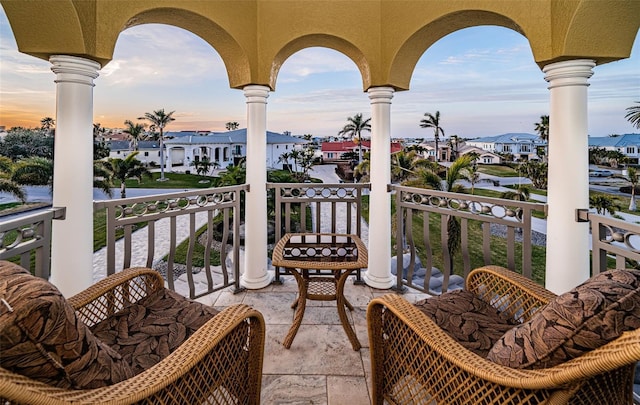 view of balcony at dusk