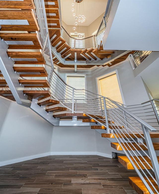 staircase with a towering ceiling