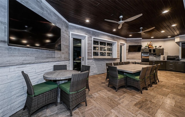 view of patio with ceiling fan and exterior kitchen