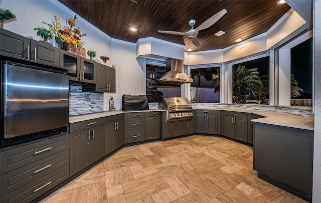 kitchen featuring wood ceiling, crown molding, refrigerator, island exhaust hood, and backsplash