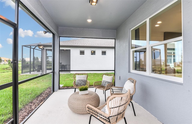 sunroom / solarium featuring plenty of natural light