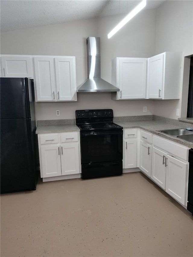 kitchen with white cabinetry, black appliances, and wall chimney exhaust hood