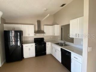 kitchen featuring white cabinets, wall chimney exhaust hood, sink, and black appliances