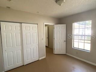 unfurnished bedroom featuring a closet