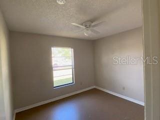 empty room featuring ceiling fan