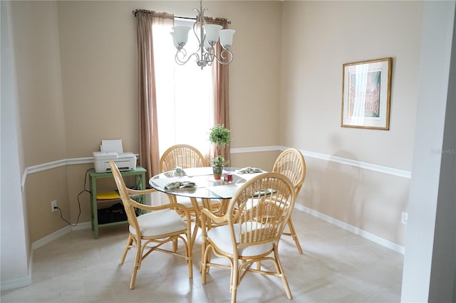 dining area featuring an inviting chandelier