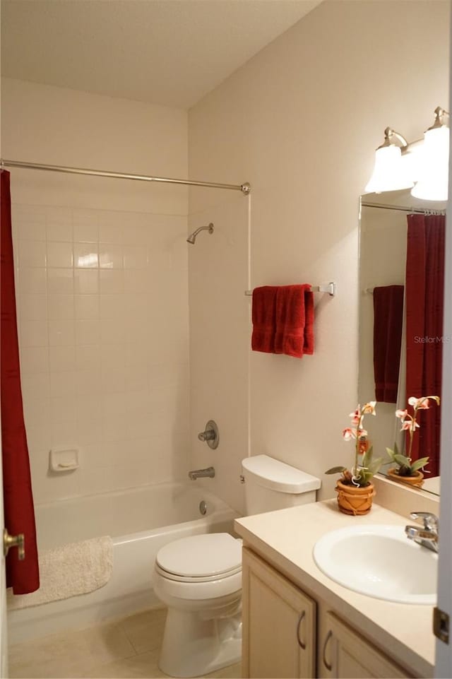 full bathroom featuring shower / tub combo, vanity, tile patterned floors, and toilet