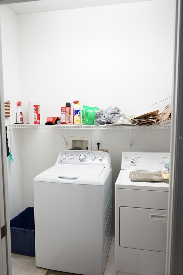 laundry area with separate washer and dryer