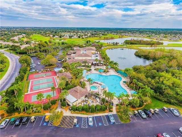 birds eye view of property with a water view