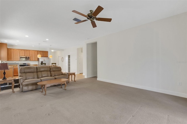 living room with light carpet, recessed lighting, visible vents, and baseboards