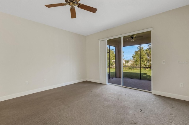 empty room with a ceiling fan, baseboards, and carpet flooring