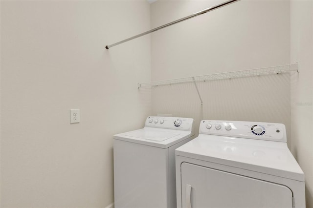 laundry area with laundry area and washer and clothes dryer