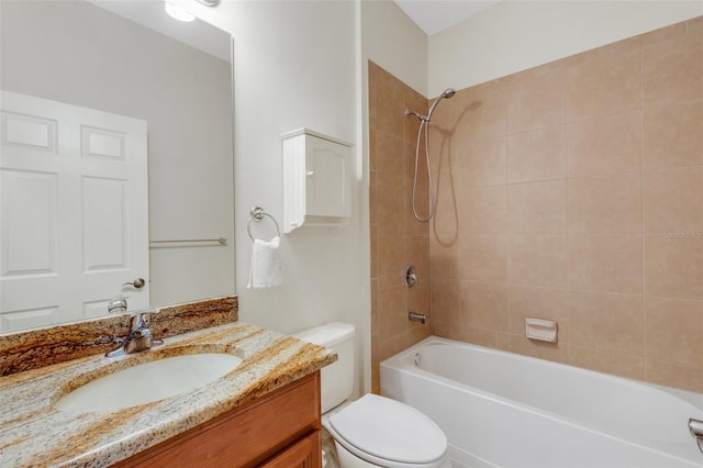 bathroom with toilet, shower / tub combination, and vanity