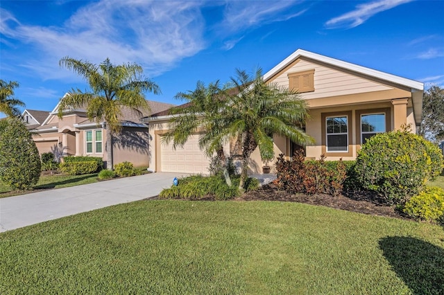 view of front facade featuring a garage, concrete driveway, a front yard, and stucco siding