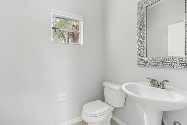 bathroom with toilet and sink