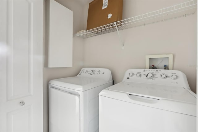 laundry room with washing machine and dryer