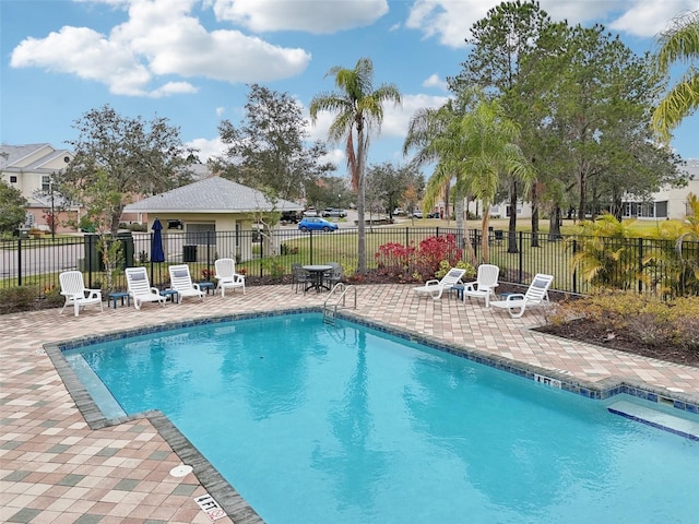 view of swimming pool with a patio