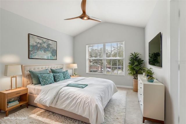 bedroom with light carpet, lofted ceiling, and ceiling fan