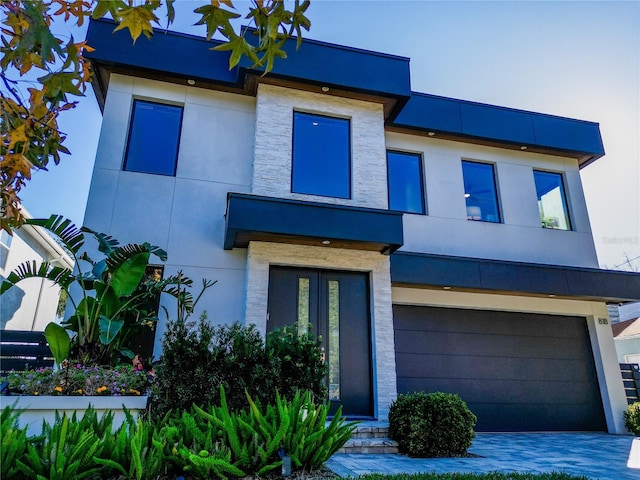 modern home featuring a garage