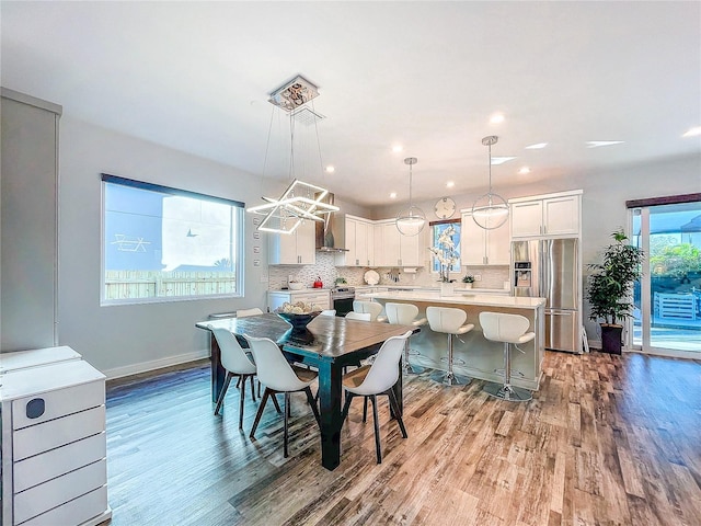 dining area with light hardwood / wood-style flooring