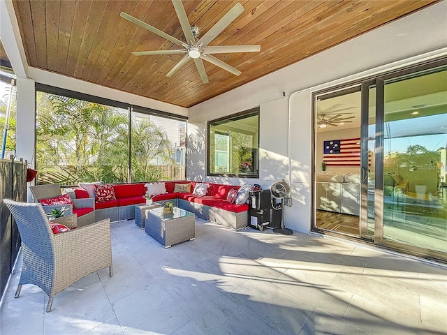 sunroom with wood ceiling, ceiling fan, and vaulted ceiling