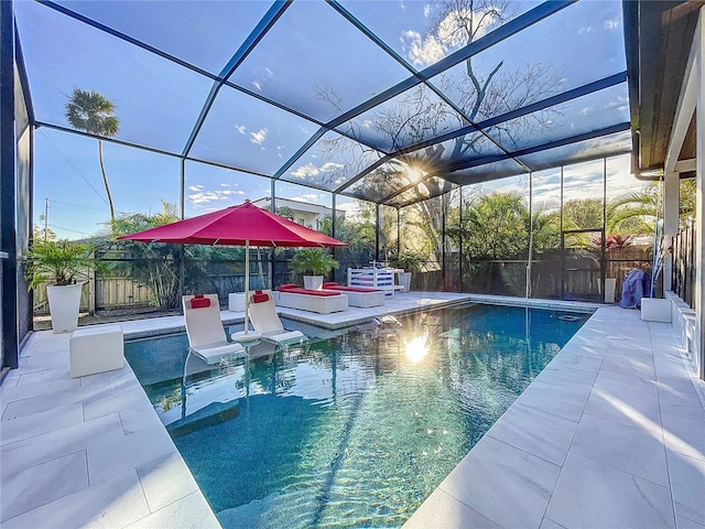 view of pool featuring a lanai, a fenced in pool, a patio, and fence