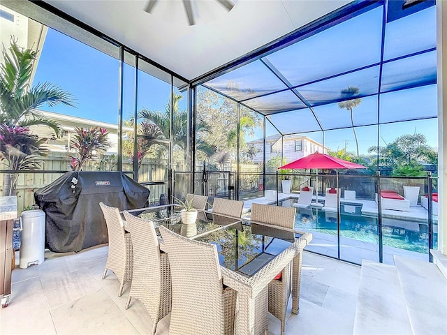 view of patio / terrace featuring a fenced in pool and glass enclosure