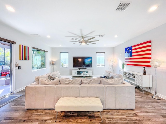 living room with hardwood / wood-style floors and ceiling fan