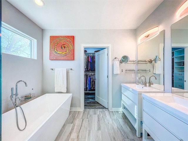 bathroom featuring vanity and a bathtub