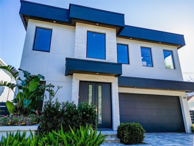 modern home featuring a garage