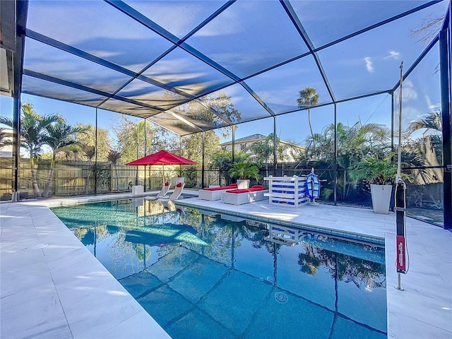 view of swimming pool with a patio area and glass enclosure