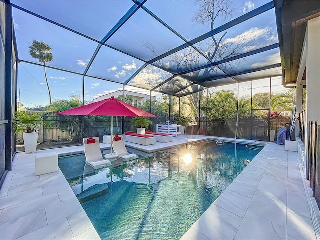 view of pool with a patio area, a fenced backyard, a fenced in pool, and a lanai