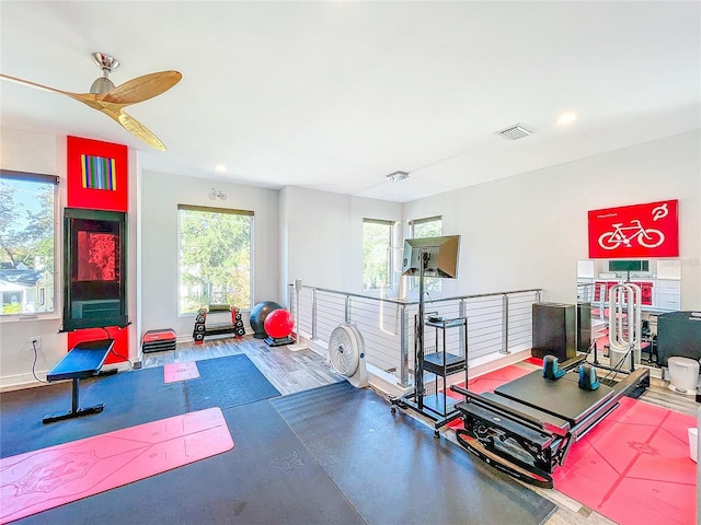 exercise room featuring visible vents and baseboards