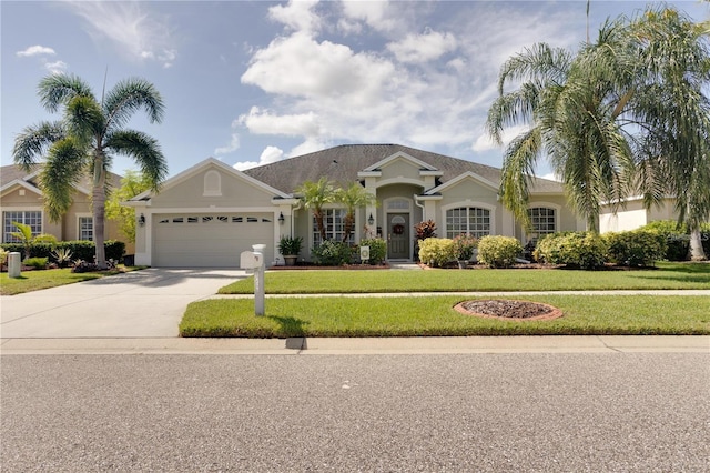 ranch-style home featuring a garage and a front lawn