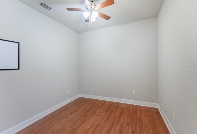 unfurnished room featuring ceiling fan and hardwood / wood-style floors