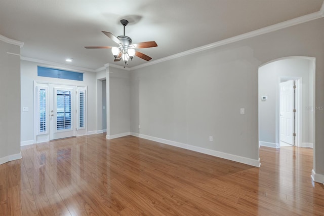 unfurnished room featuring crown molding, light hardwood / wood-style floors, and ceiling fan