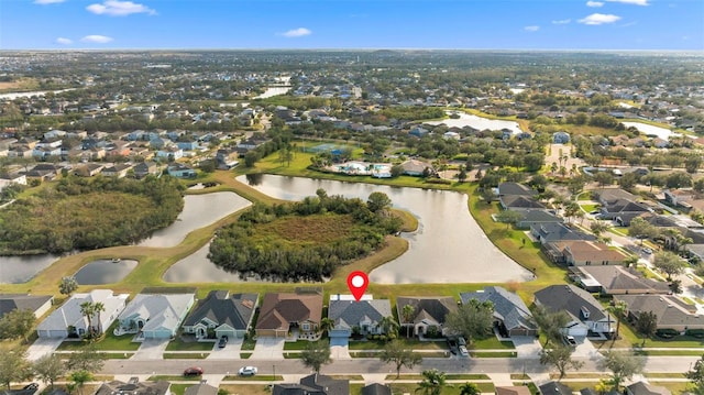 birds eye view of property featuring a water view