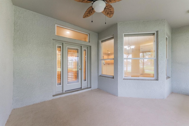 doorway to property with a patio and ceiling fan