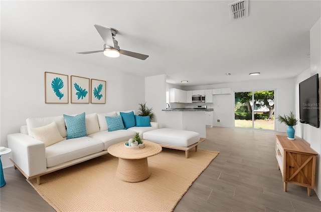 living room featuring ceiling fan