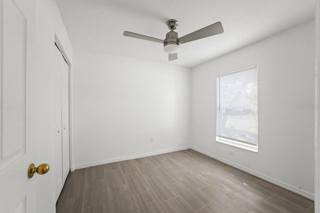 unfurnished bedroom with a closet and ceiling fan