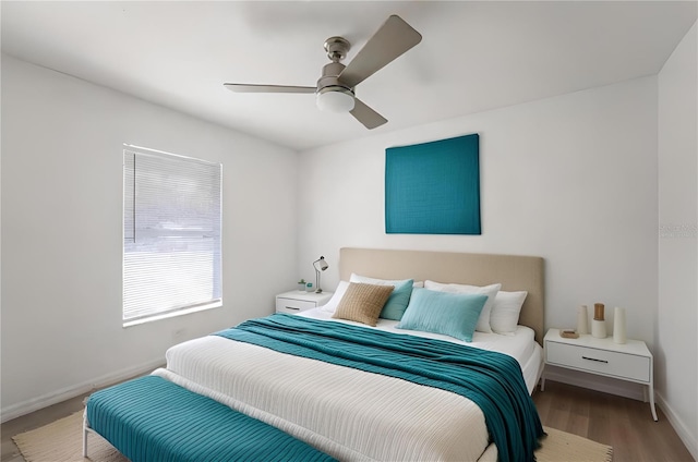 bedroom with hardwood / wood-style flooring and ceiling fan