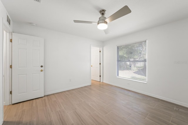 spare room with ceiling fan