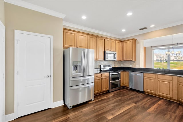 kitchen with sink, crown molding, backsplash, stainless steel appliances, and a notable chandelier