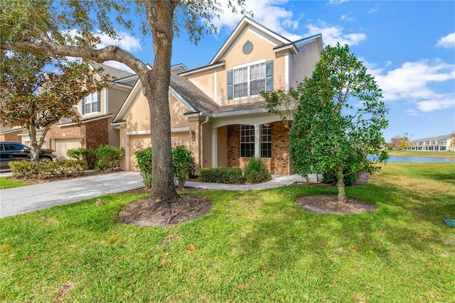 view of front of property featuring a garage and a front yard