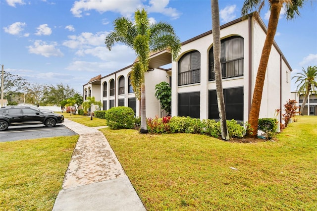 view of home's exterior with a yard