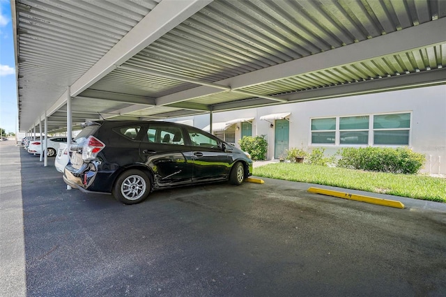 view of vehicle parking with a carport