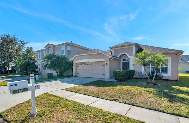 view of front of house featuring a garage and a front yard