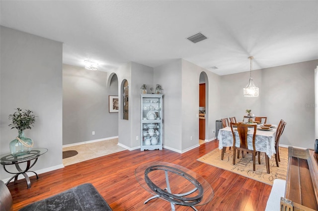 dining room with wood-type flooring