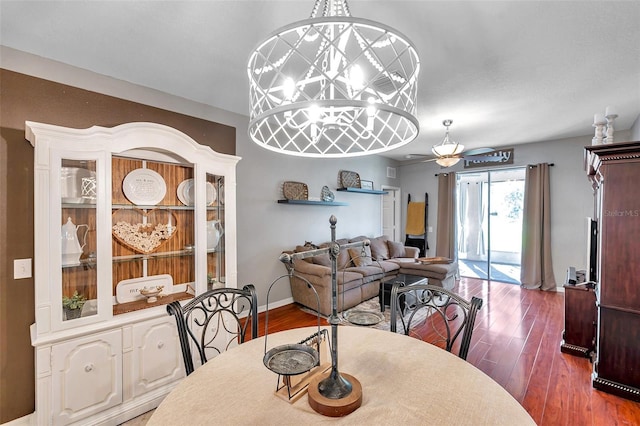 dining area featuring hardwood / wood-style floors and ceiling fan