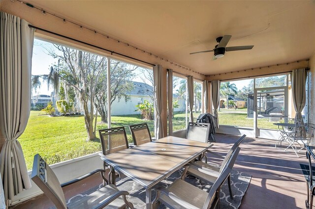 sunroom / solarium with ceiling fan